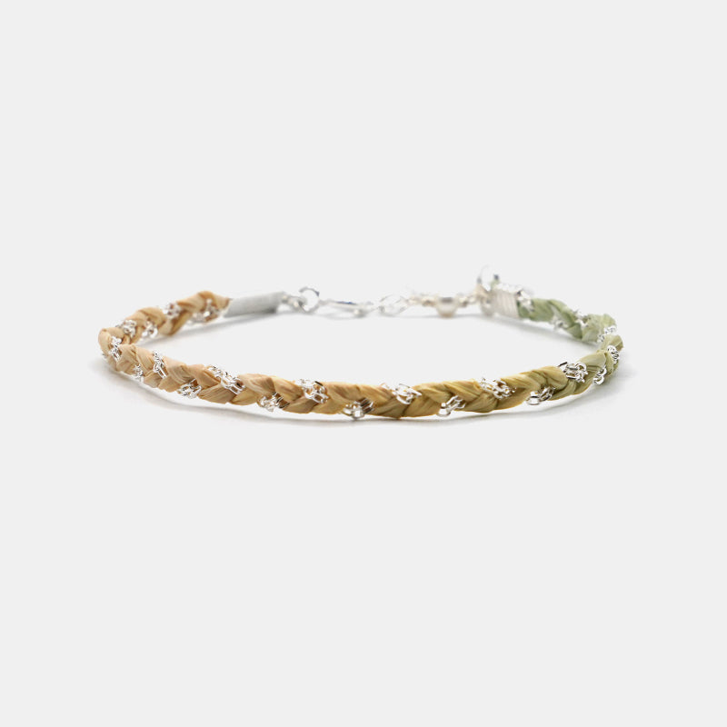 Bracelet with braided design on a white background