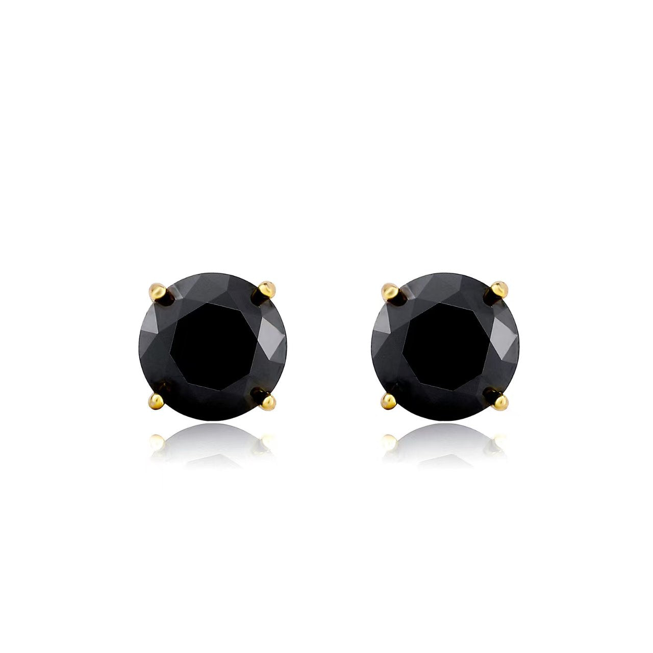 Pair of black gemstone stud earrings with gold prongs on a white background
