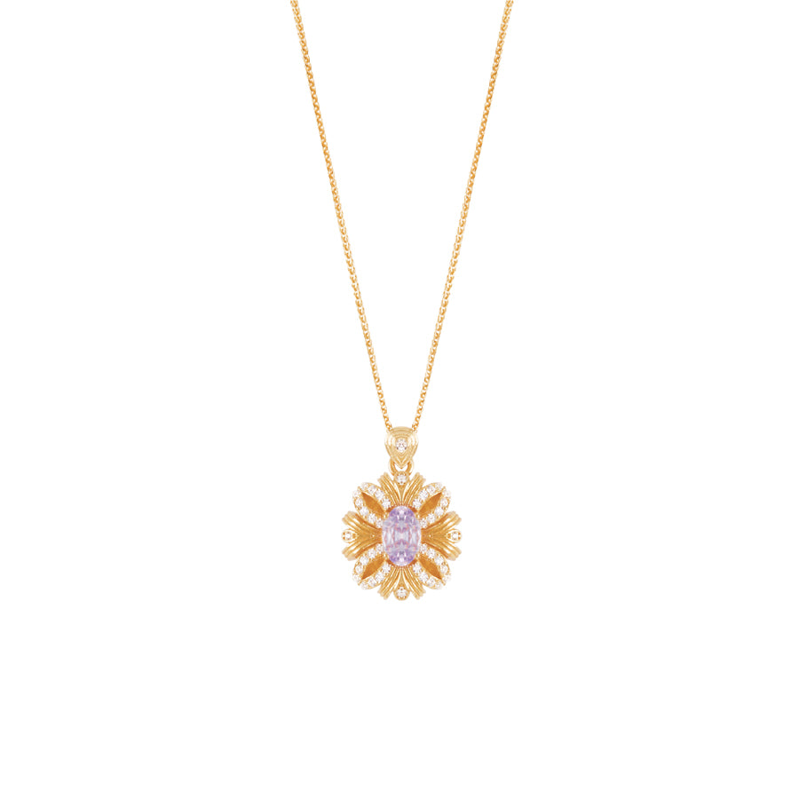 Gold necklace with a floral pendant on a white background