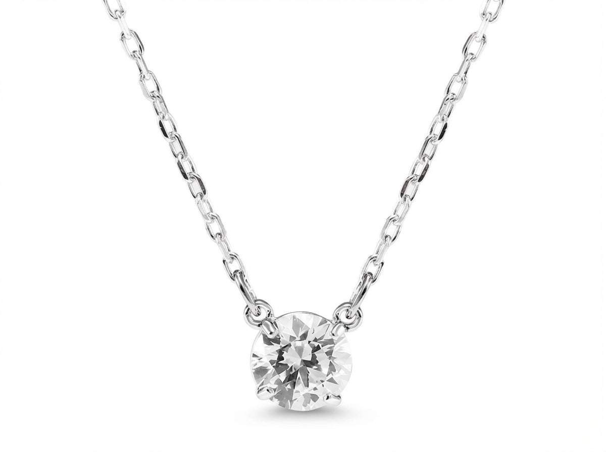 Silver necklace with a round diamond pendant on a white background