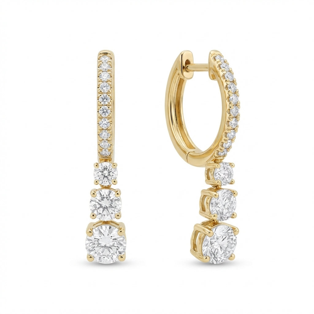 Gold hoop earrings with diamond accents on a white background
