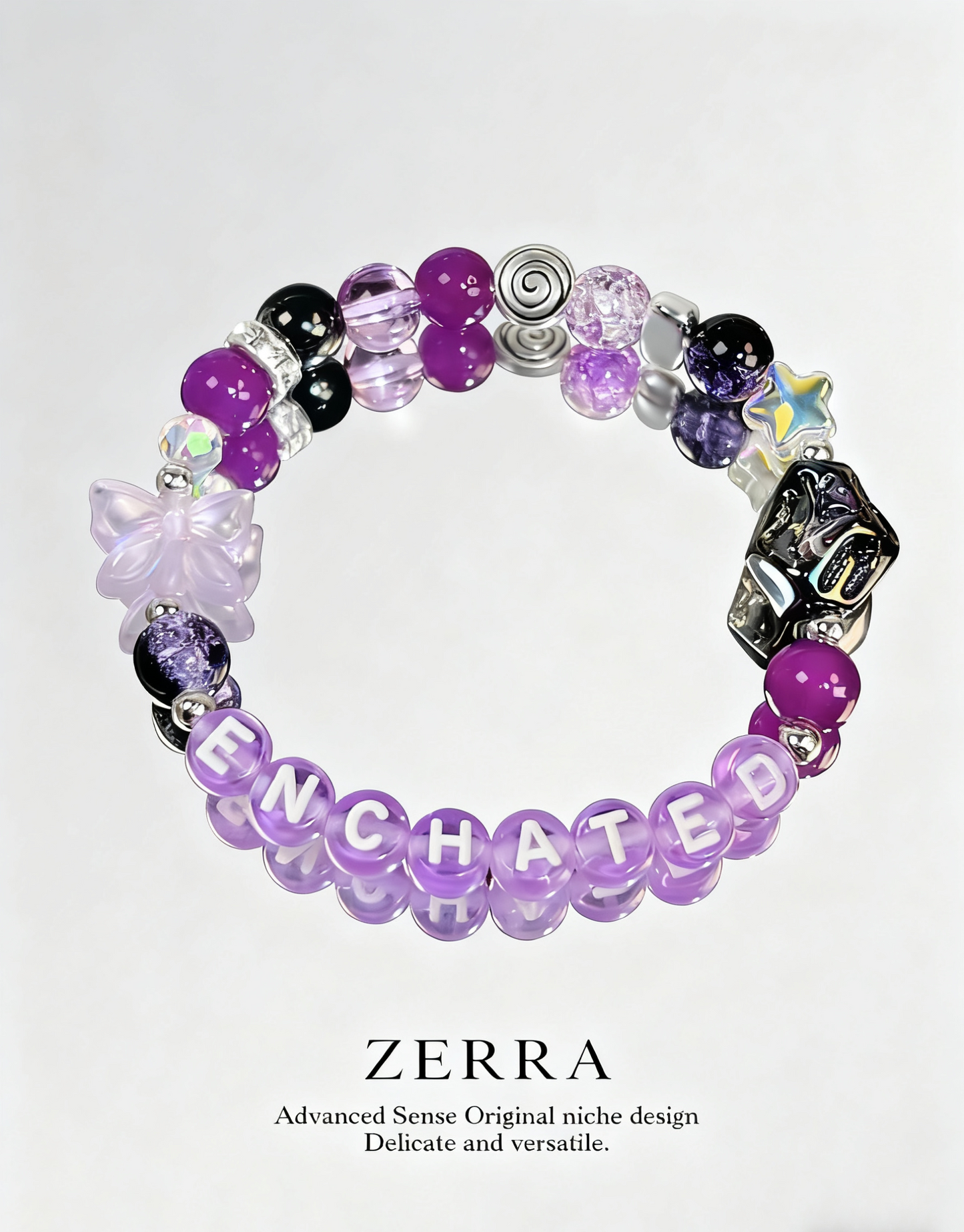 Purple beaded bracelet with 'ENCHANTED' on a white background, featuring the brand 'ZERRA'.