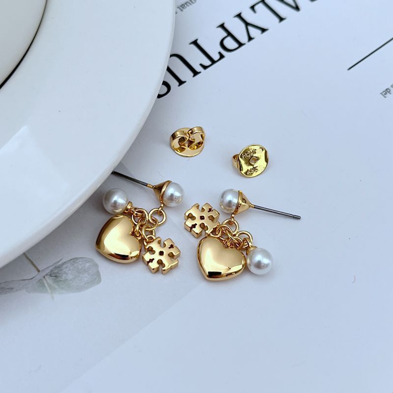 Close-up focusing on the chevron charm and how it connects to other charms or chains.