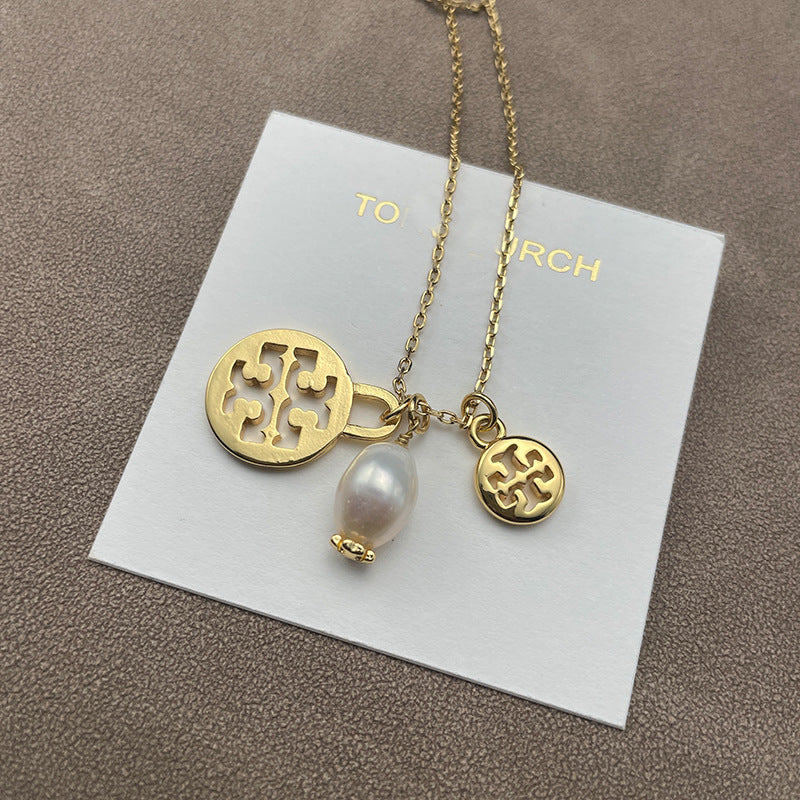 Split close-up focusing on the chevron’s engraved texture and the pearl’s smooth luster side by side.