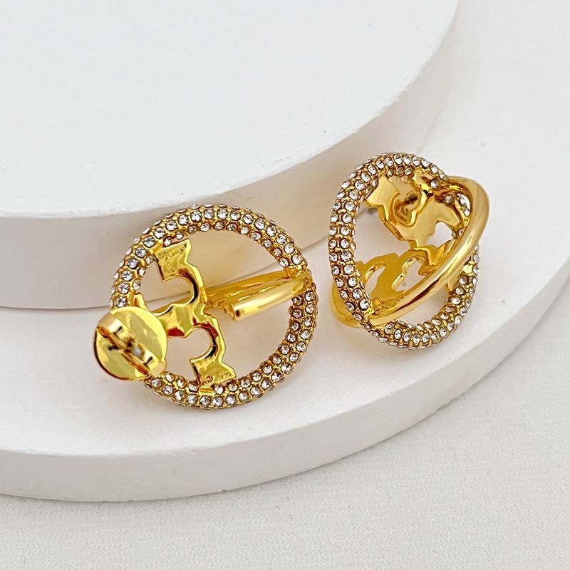 Close-up focused on where the hoops connect and the pave crystal setting, showcasing craftsmanship.