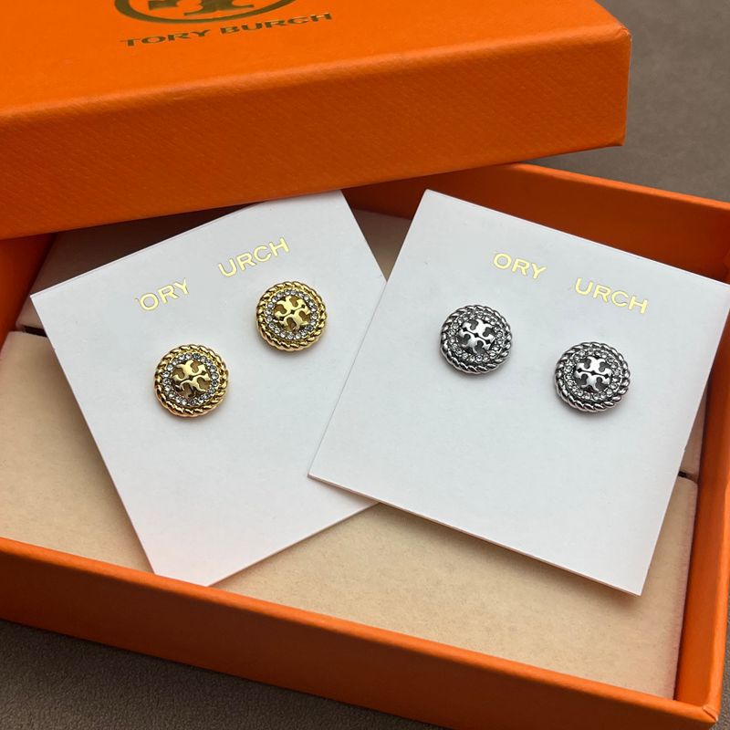 Both earrings displayed face-up on a dark, smooth surface (black marble), highlighting the contrast between the textured rope border and crystal sparkle.