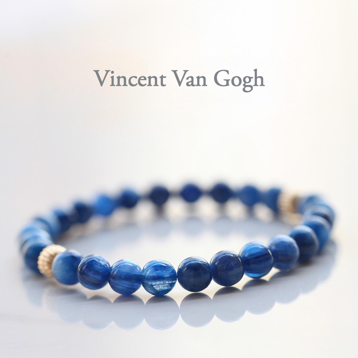 Blue beaded bracelet with gold accents on a white background, featuring the name 'Vincent Van Gogh'.