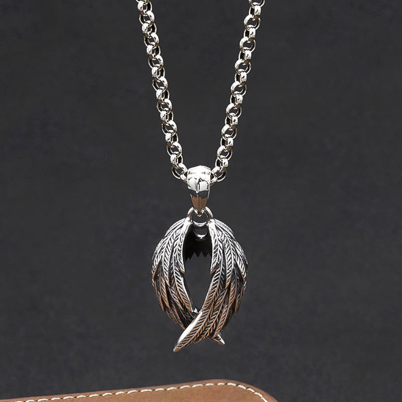 Silver necklace with a unique pendant on a dark background