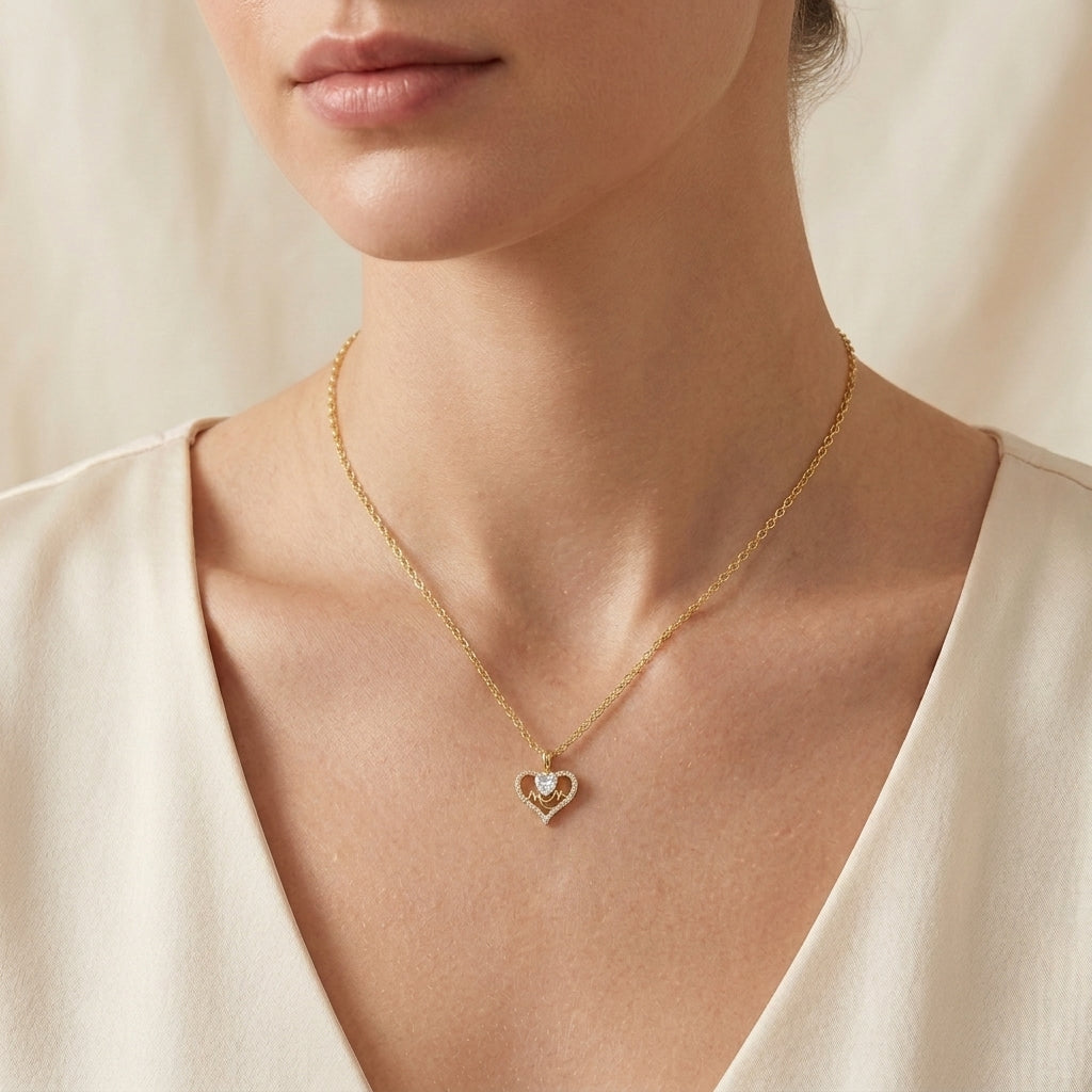 Close-up shot of a woman wearing the gold MOM heart cut moissanite pendant necklace.