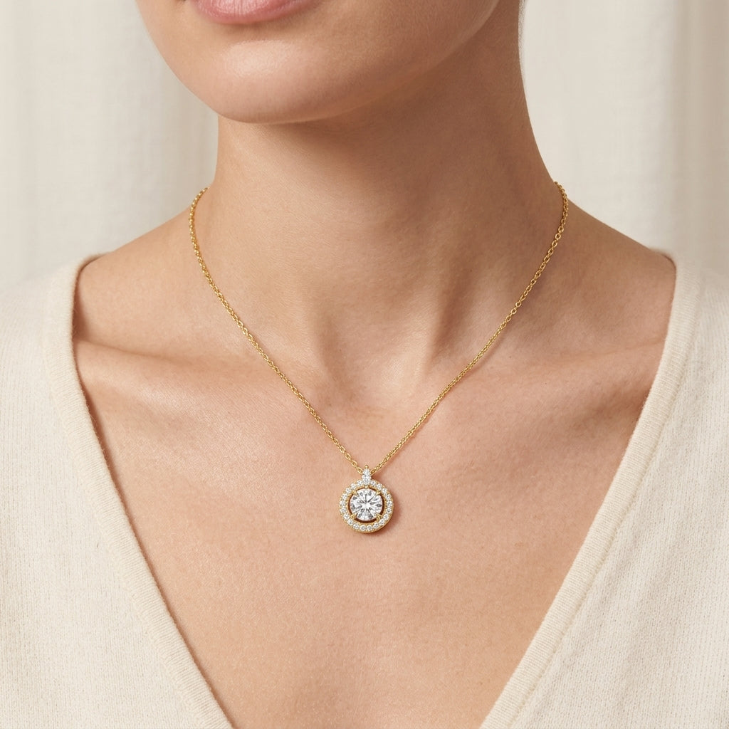 Model wearing gold round cut moissanite halo pendant necklace in an elegant evening wear setting.