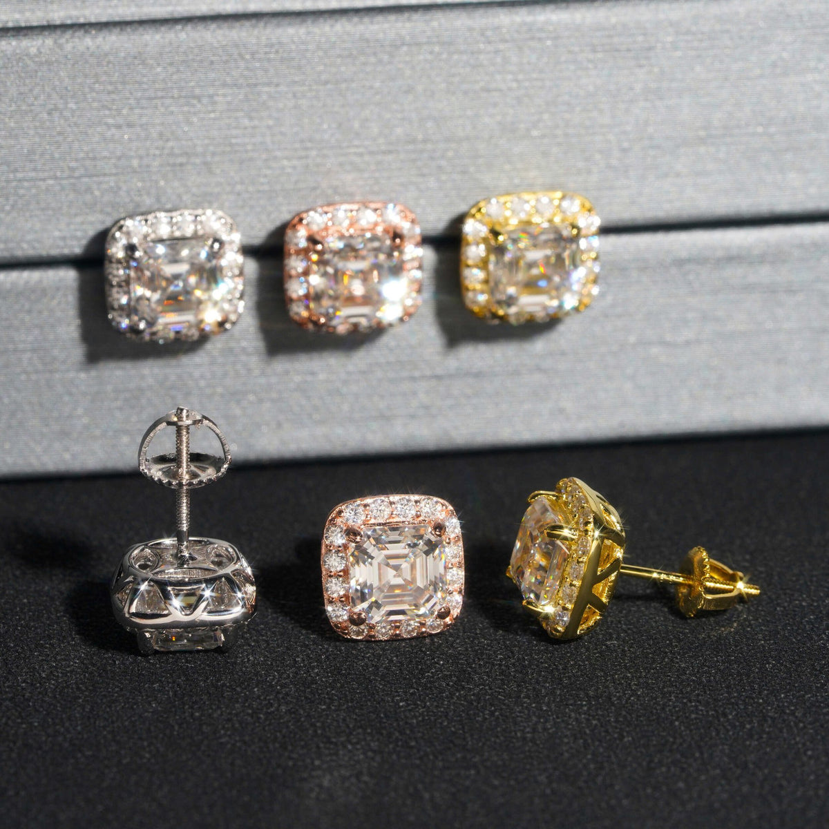 Three-tone iced out asscher cut halo solitaire moissanite stud earrings showing screw back posts and back basket