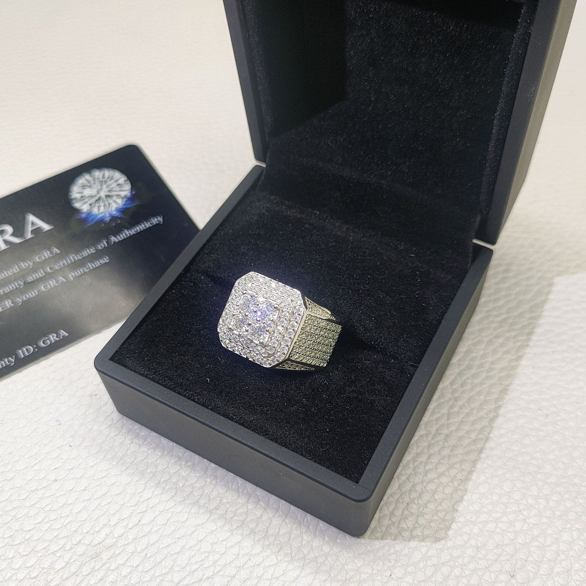 Back view showing detailed lattice hollow back structure of iced out square cluster ring