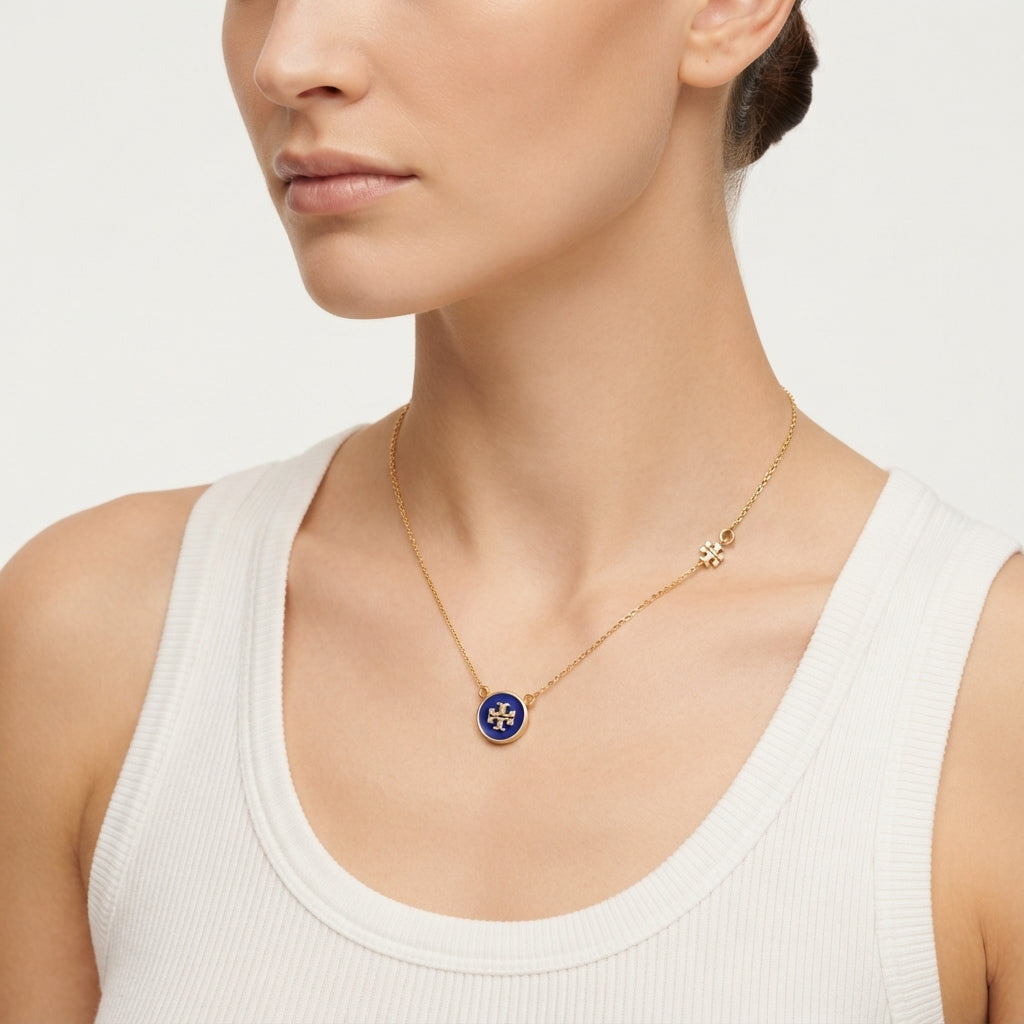 Zerra Jewelry Tory Burch Kira Enamel Pendant Necklace with color block design, featuring a sleek enamel pendant on a delicate chain.