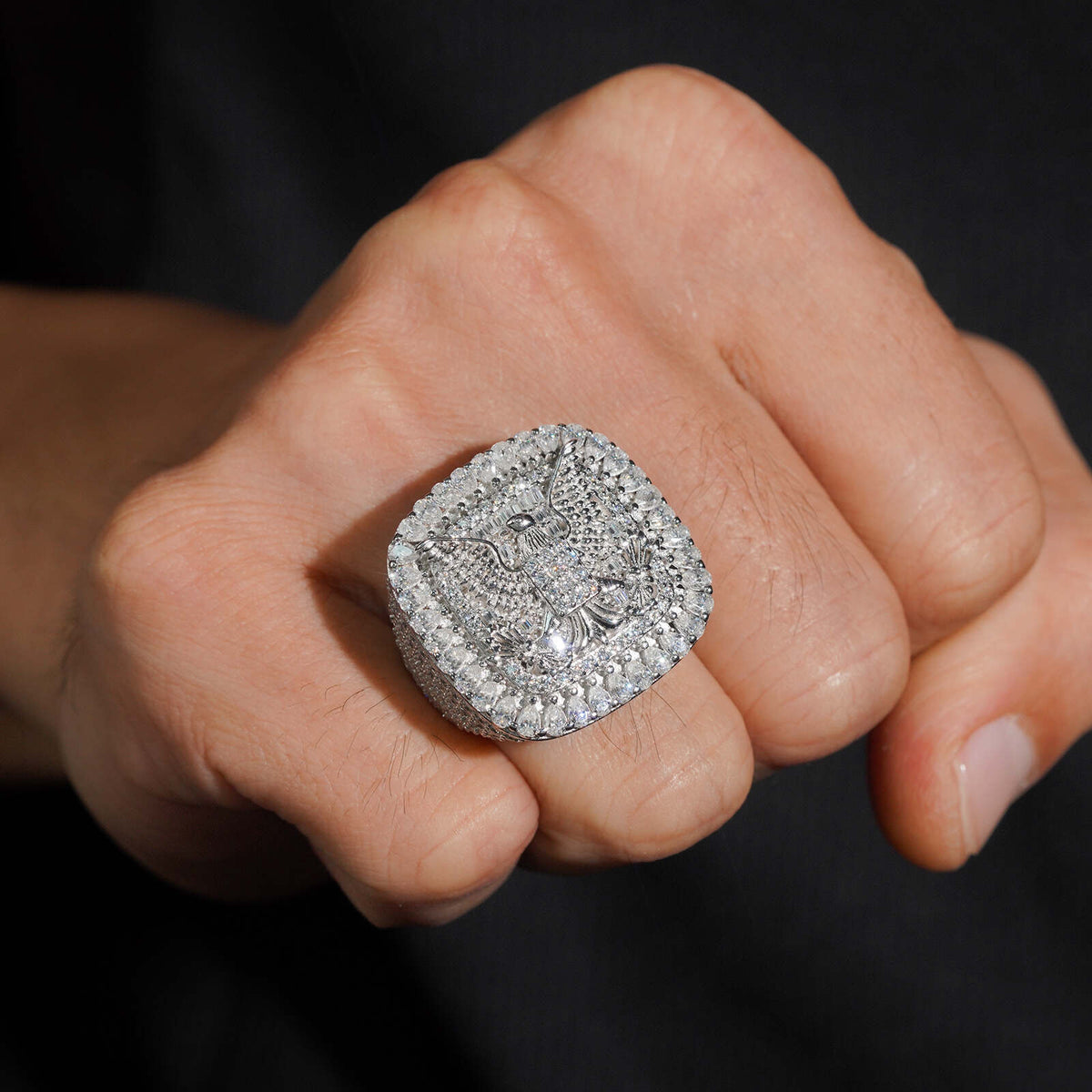 Model wearing S925 sterling silver iced out moissanite eagle cushion ring on fist