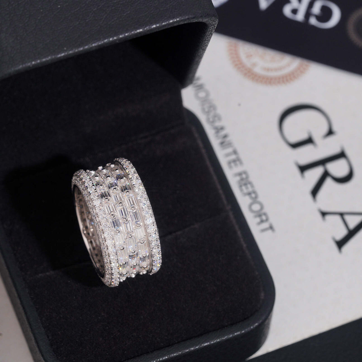 Multi row baguette and round moissanite wide ring presented in black jewelry box with GRA certificate
