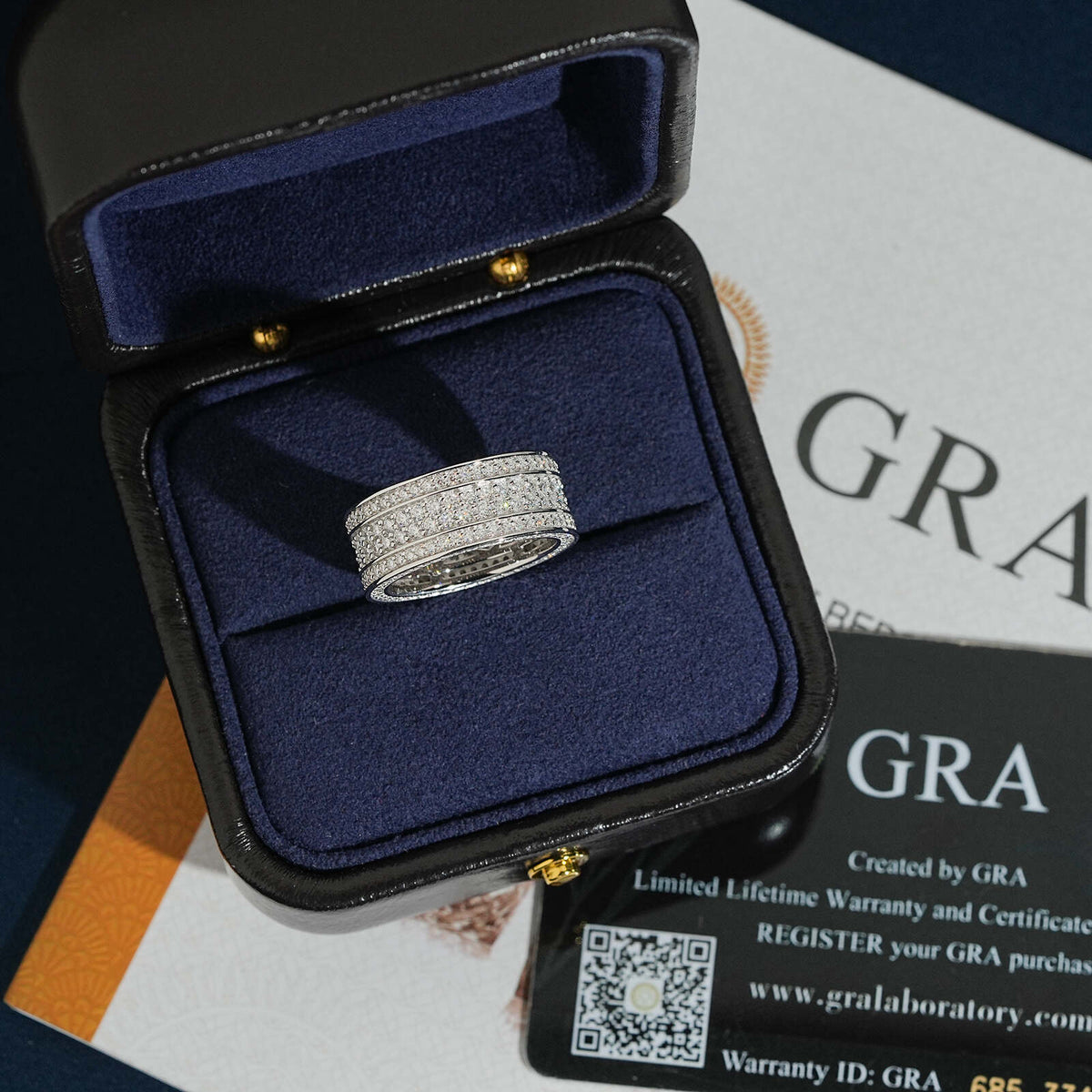 Multi row micro pave moissanite wide ring presented in dark navy gift box with GRA certificate
