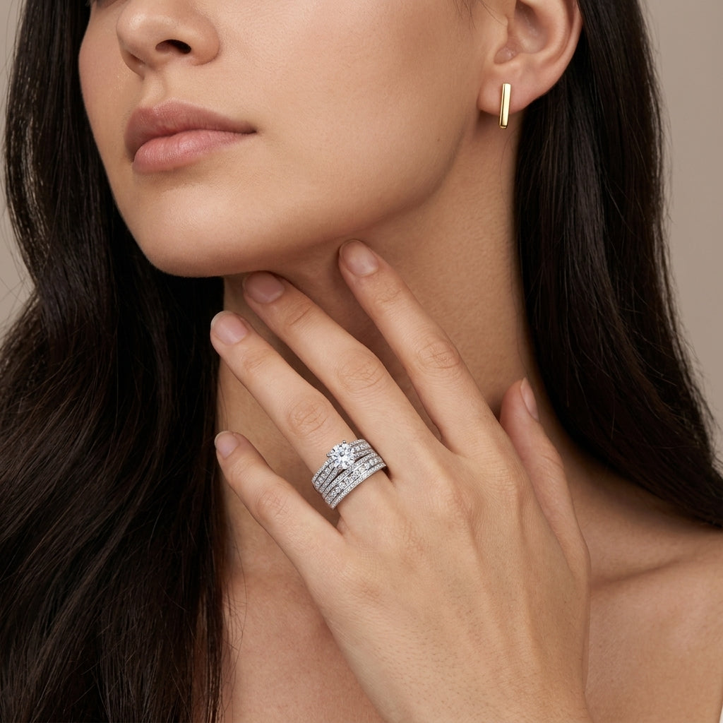 Close-up of a model wearing luxury round cut moissanite multi-row pave wedding ring set.