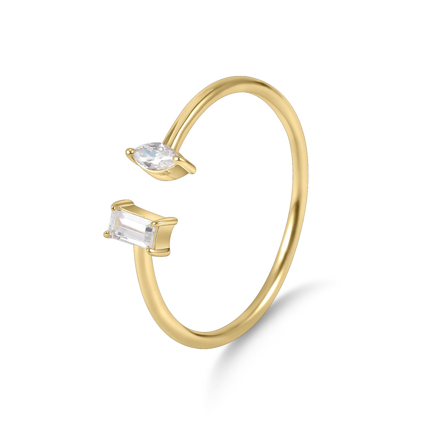 Gold ring with two gemstones on a white background