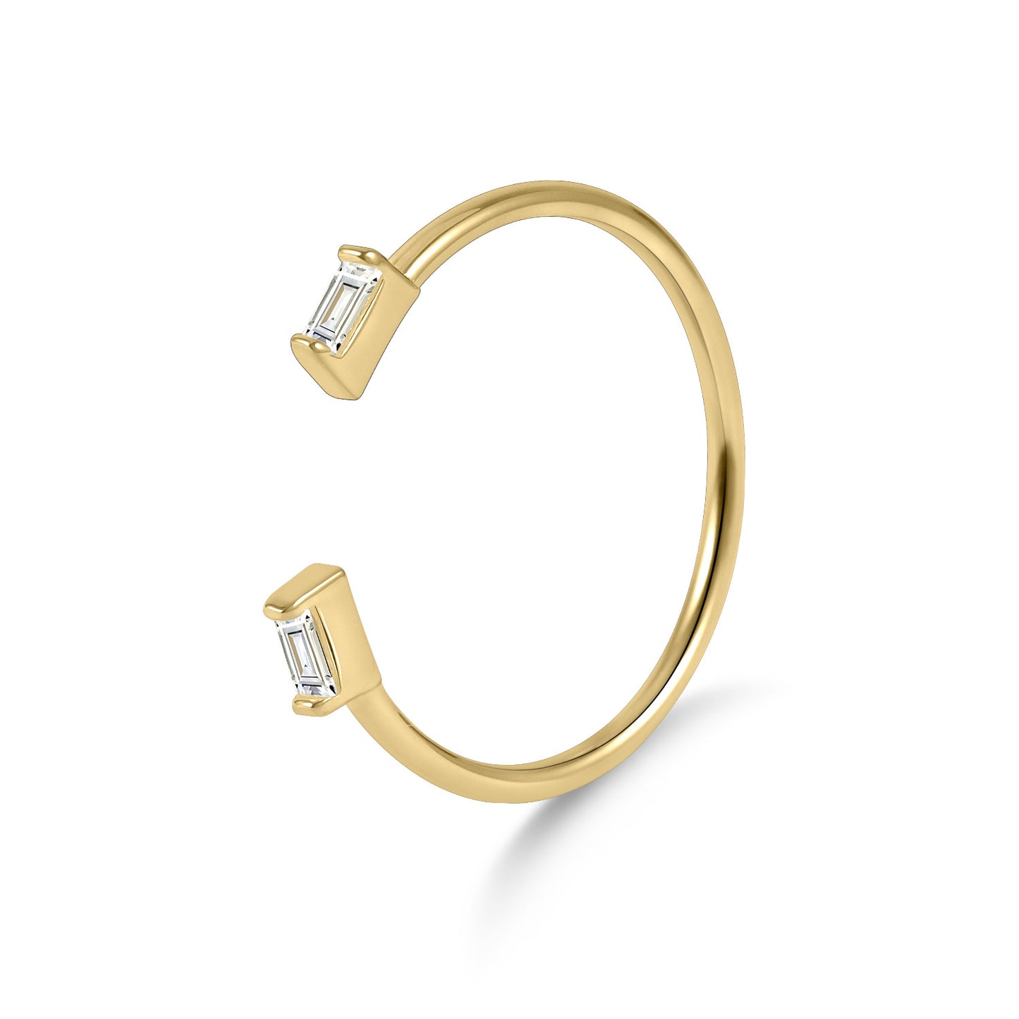 Gold open cuff bracelet with baguette cut gemstones on a white background