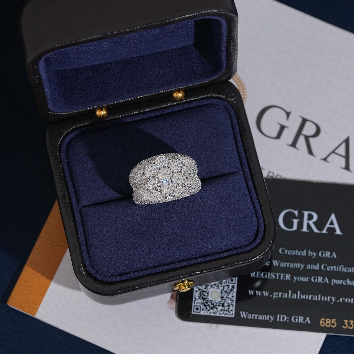 Seven stone flower cluster moissanite wide ring presented in dark navy velvet gift box with GRA certificate