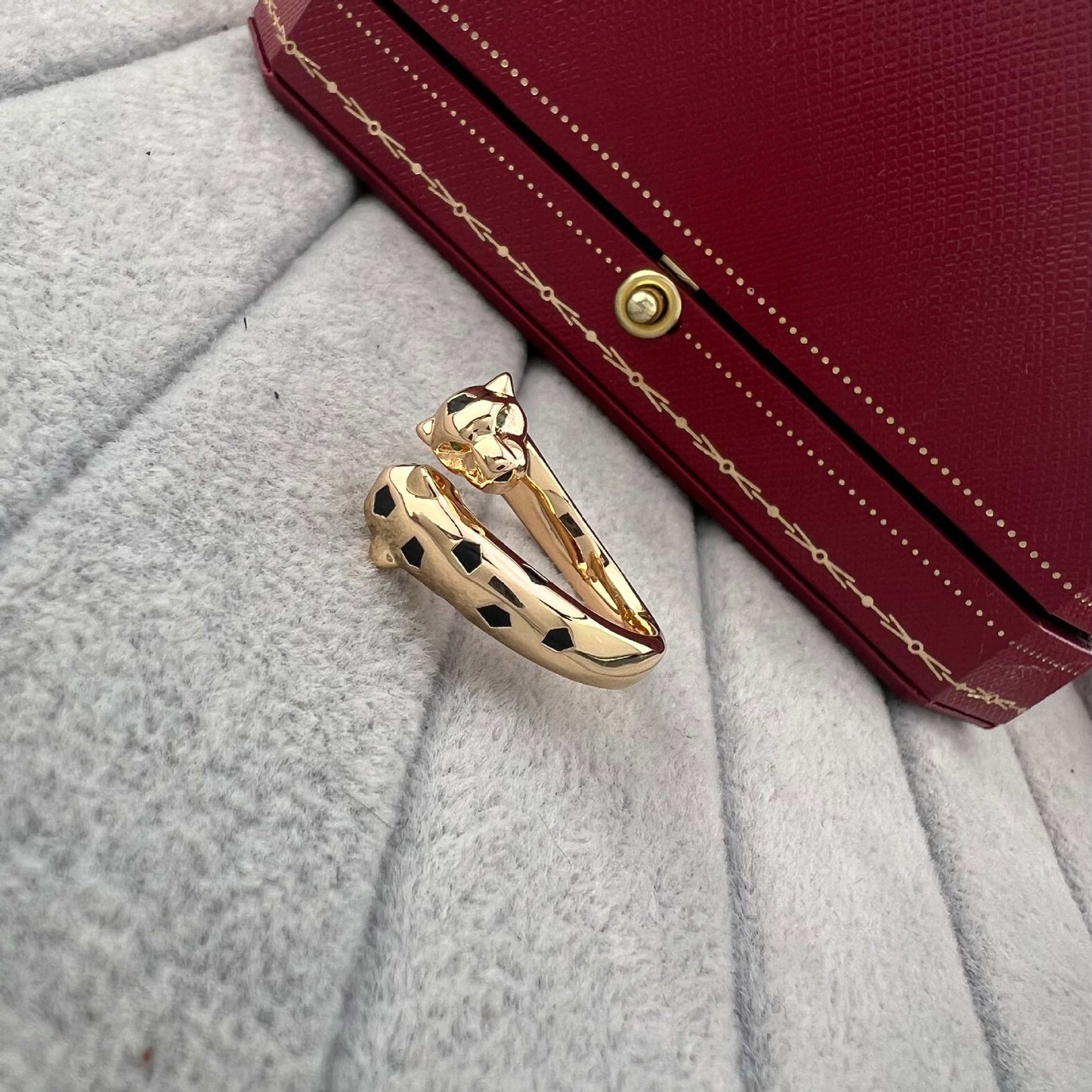 Zerra Jewelry Cartier Panthère de Narrow garnet ring with black lacquer accents, elegant and stylish jewelry design.