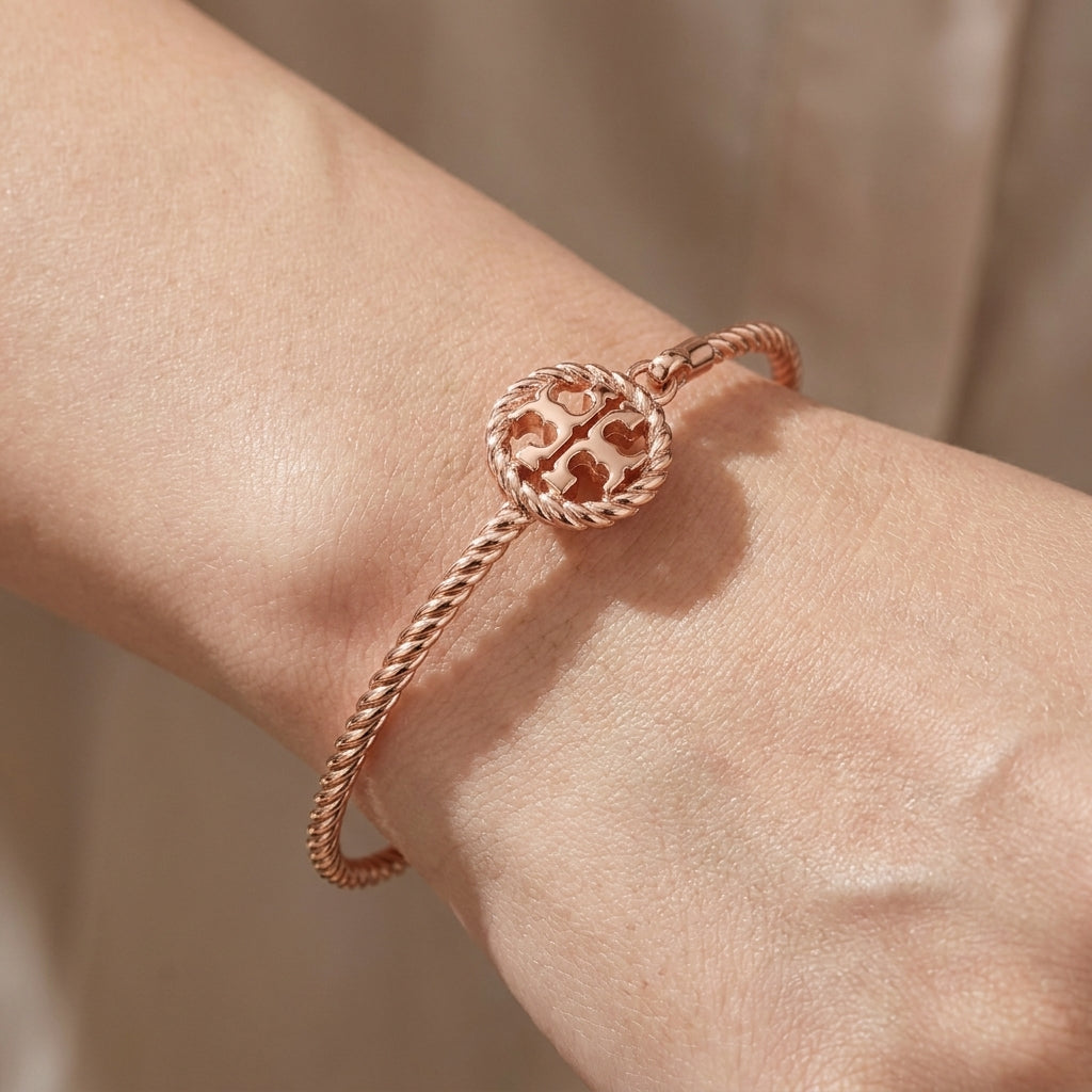 Close-up of the Tory Burch Rope Cuff showing the oval shape for a comfortable, ergonomic wrist fit