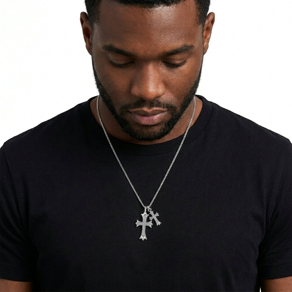 Man wearing vintage gothic double cross pave charm box chain necklace with black t-shirt.