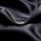 Angled view of 0.49 ctw double row pave lab grown diamond eternity ring resting on dark black silk