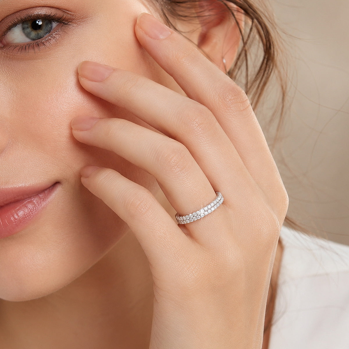 Model wearing 0.49 ctw double row pave lab grown diamond wedding band on finger