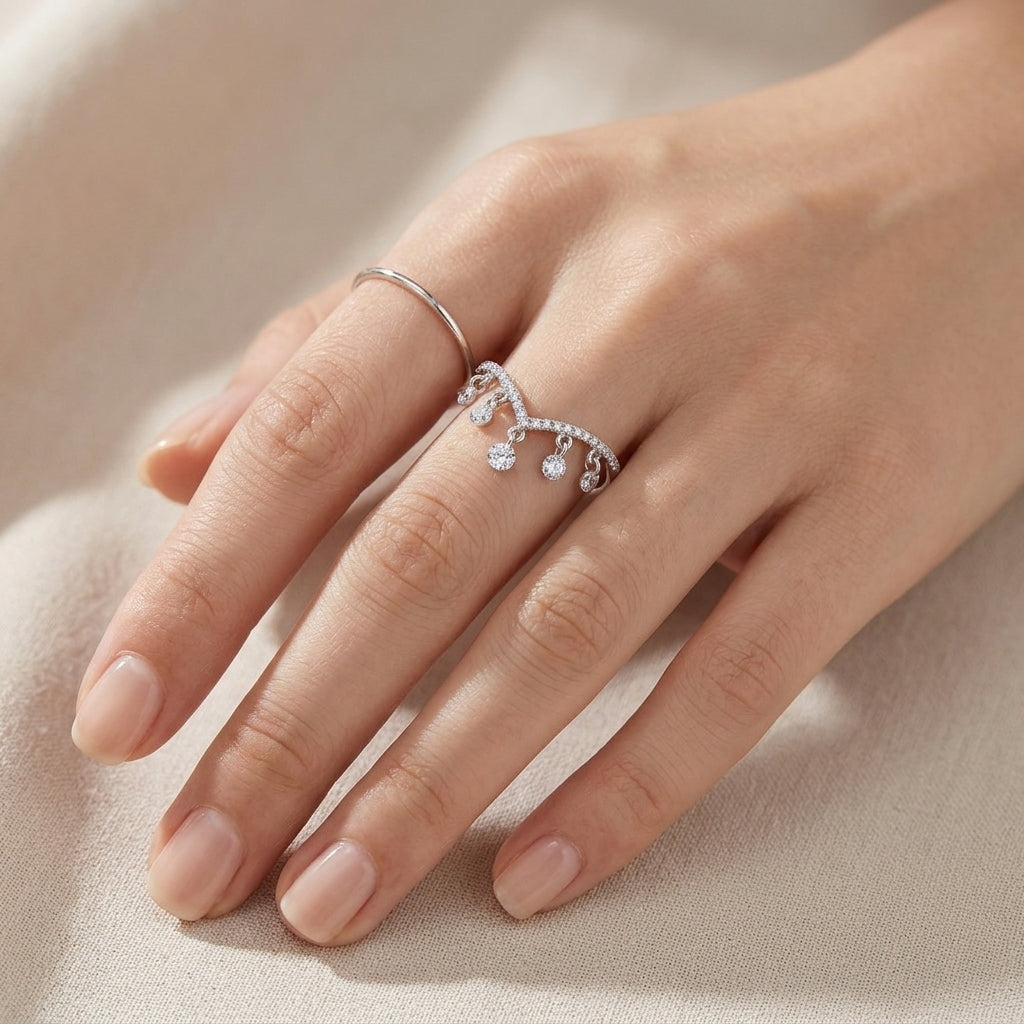 Model wearing 0.49ct V-shaped wishbone lab diamond dangling charm ring.