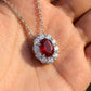 Close-up of 0.8ct Oval Ruby Pendant Necklace held in hand, showing gemstone brilliance