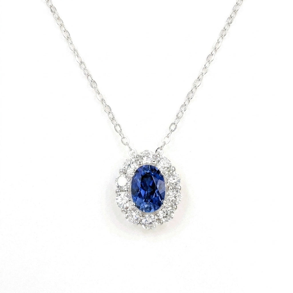 0.8ct oval cut blue sapphire pendant necklace, diamond halo setting, sterling silver.