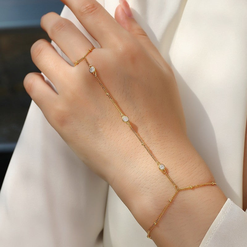 Bracelet worn for elegant evening or holiday party. Alt: “Holiday Sparkle: 18K Gold Moissanite Bracelet.”