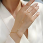 Bracelet worn for elegant evening or holiday party. Alt: “Holiday Sparkle: 18K Gold Moissanite Bracelet.”