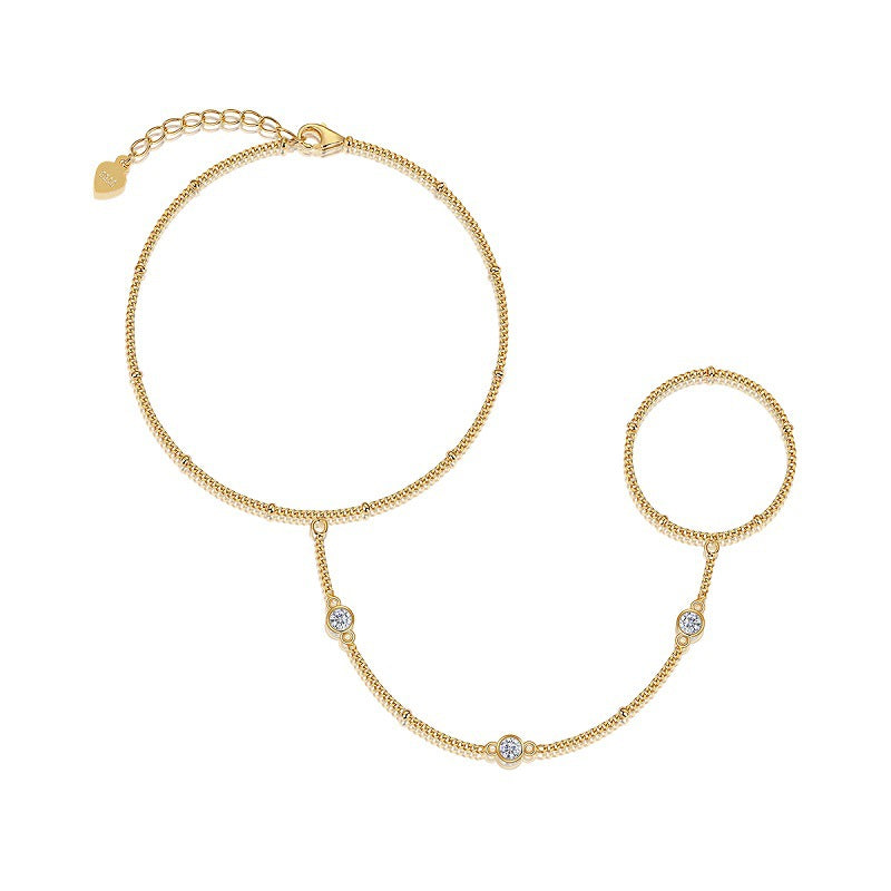 Gold moissanite bracelet on neutral or holiday-inspired background, showing continuous sparkle. Alt: “0.3ctw Moissanite 925 Sterling Silver Bracelet with 18K Gold Plated – Diamond Alternative Tennis Bracelet.”