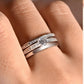 Ring worn as delicate engagement or promise ring. Alt: “Understated Elegance: Round Moissanite Ring.”