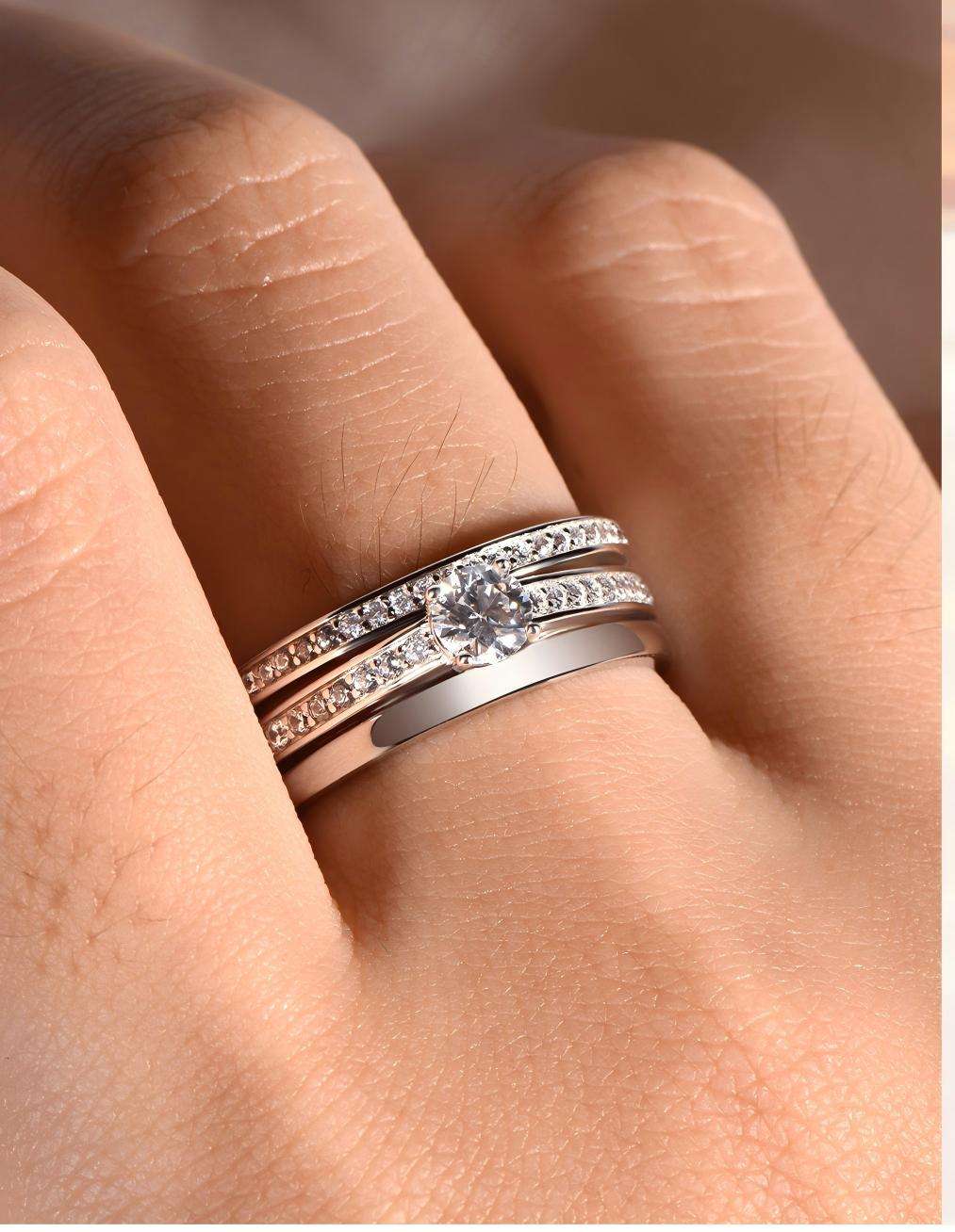 Ring worn as delicate engagement or promise ring. Alt: “Understated Elegance: Round Moissanite Ring.”