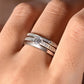 Ring worn as delicate engagement or promise ring. Alt: “Understated Elegance: Round Moissanite Ring.”