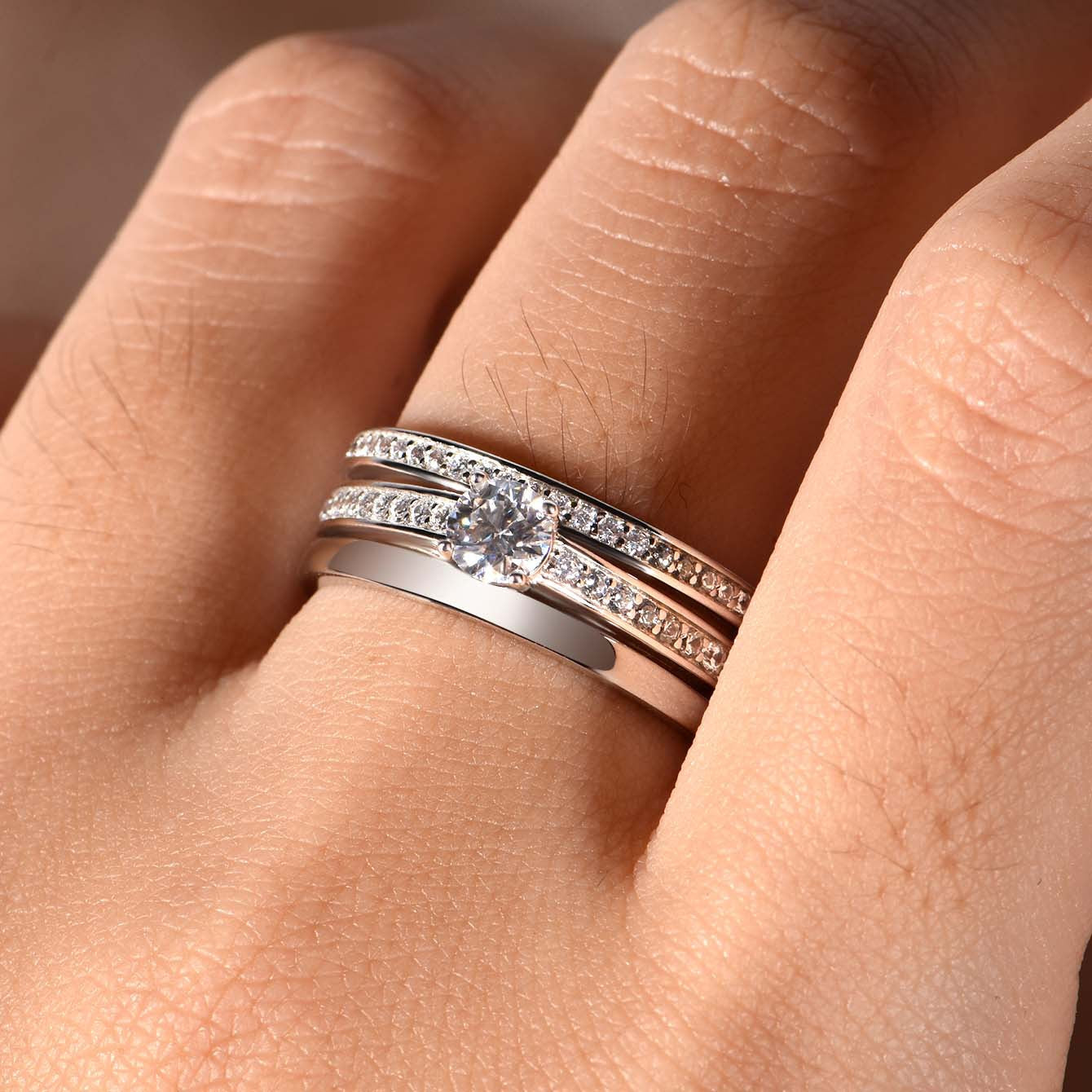 Ring worn as delicate engagement or promise ring. Alt: “Understated Elegance: Round Moissanite Ring.”