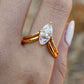Set worn as double-stacked wedding rings. Alt: “Customizable Elegance: Marquise Diamond Bridal Set.”