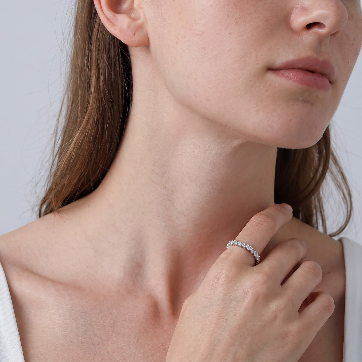 Model wearing 1.56 ctw marquise cut lab grown diamond eternity ring on finger