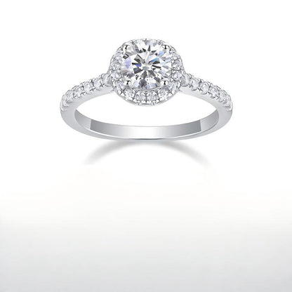 Front symmetrical view of 1 carat round moissanite halo ring with micro pave band.