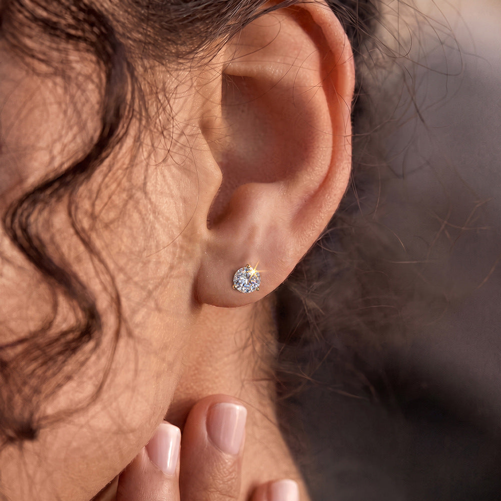 10K & 14K &1 8KModel wearing 10k yellow gold 3mm round cut lab diamond stud earrings on ear lobe