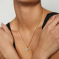 Model wearing 10k yellow gold 7x9mm four-prong oval lab diamond engagement pendant necklace   