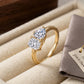 10k yellow gold heart and princess cut toi et moi lab-grown diamond ring displayed on beige jewelry tray