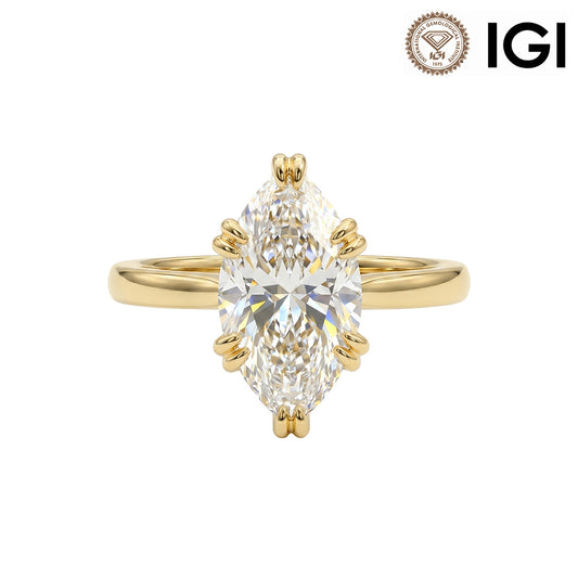 10k yellow gold marquise cut lab-grown diamond double claw prong engagement ring with IGI logo on white studio background