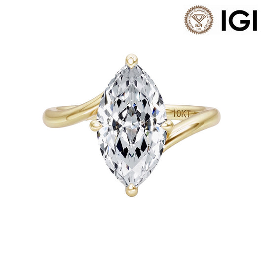 10k yellow gold marquise cut lab-grown diamond twist solitaire engagement ring with IGI logo isolated on white background