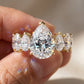 Close-up of hand holding 10k yellow gold pear cut lab diamond five-stone engagement ring showing sparkle   