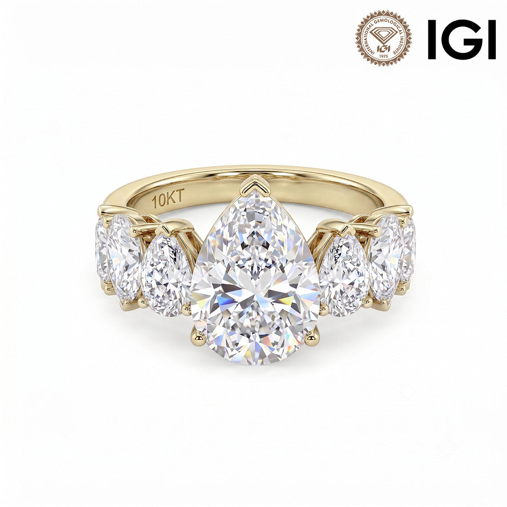 10k yellow gold pear cut lab-grown diamond five-stone engagement ring with IGI logo on white studio background