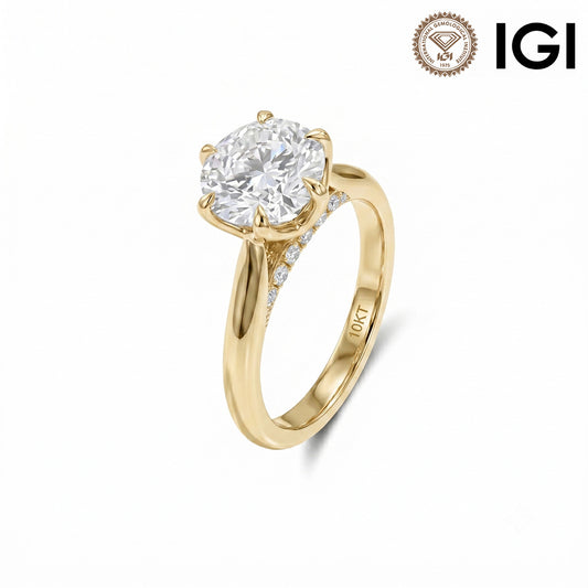 10k yellow gold round cut lab diamond six-prong solitaire engagement ring with IGI logo on white studio background